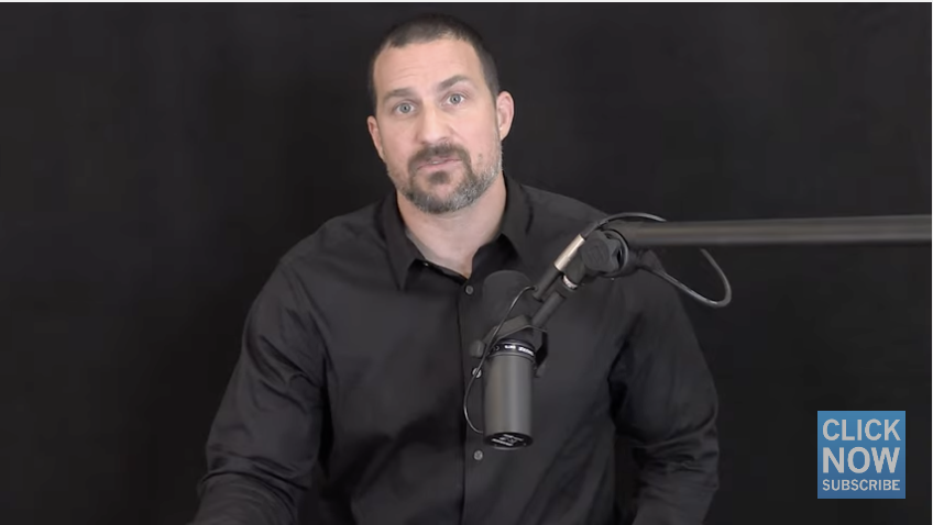 Dr. Andrew Huberman is pictured against a black background where he is speaking into a microphone.